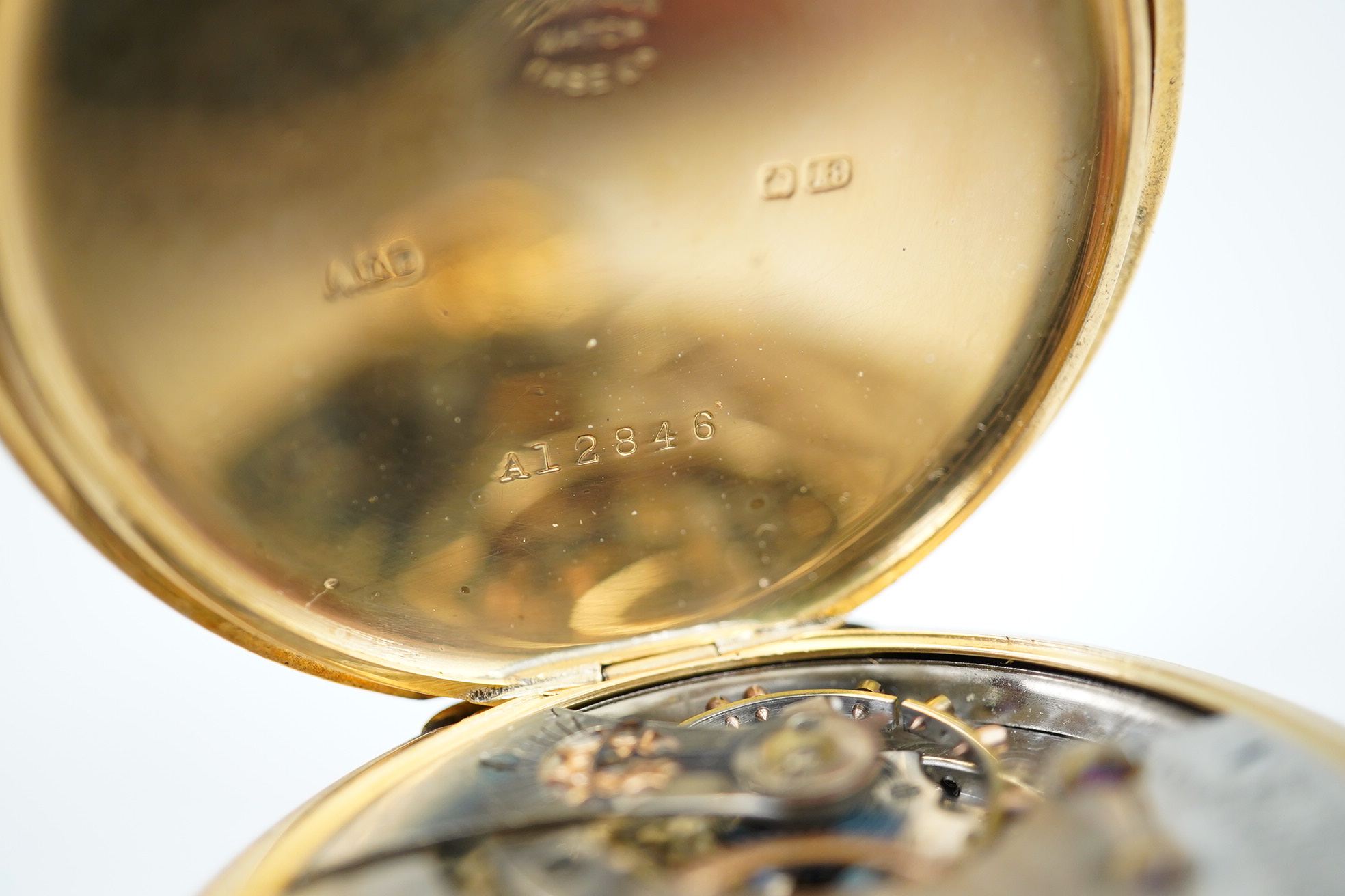 An Edwardian engine turned 18ct gold Waltham hunter keyless pocket watch